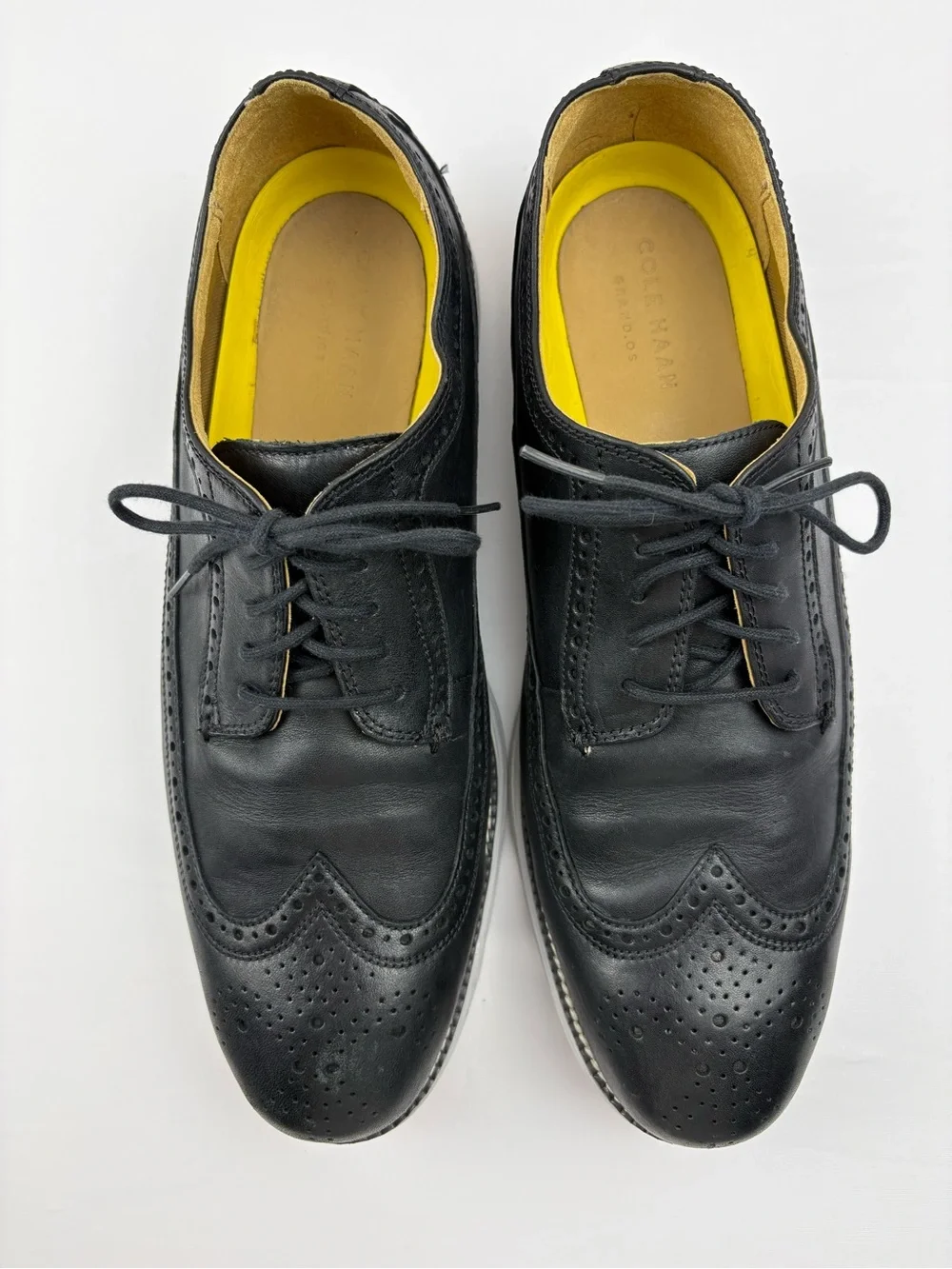 Cole Haan Original Grand wingtip Oxford shoes in black leather.